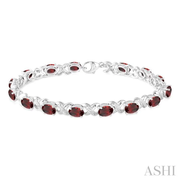 Colorful Stackable Bracelets-7x5 mm Oval Cut Garnet and 1/20 Ctw Round Cut Diamond Fashion Bracelet in Sterling Silver