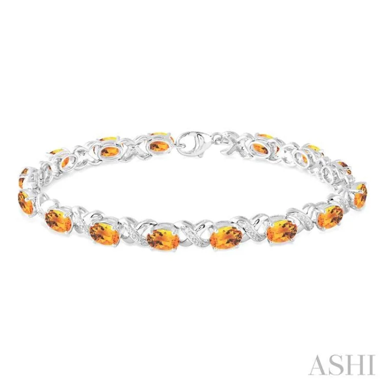 Simple Heart Charm Bracelets-7x5 mm Oval Cut Citrine and 1/20 Ctw Round Cut Diamond Fashion Bracelet in Sterling Silver